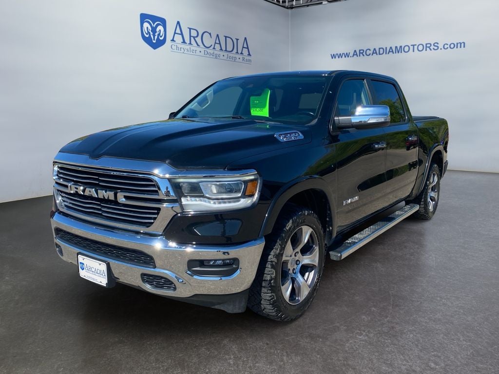 2021 RAM 1500 Laramie in Diamond Black Crystal Pearlcoat — front three-quarter view