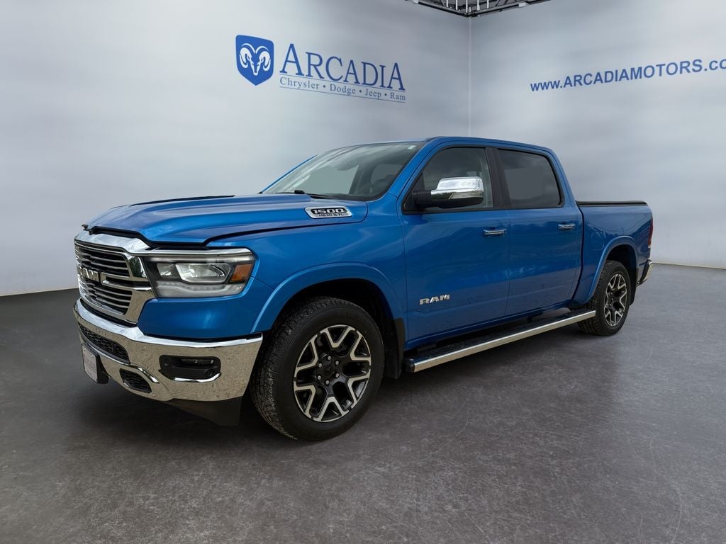 2020 RAM 1500 Laramie in Hydro Blue Pearlcoat — front three-quarter view