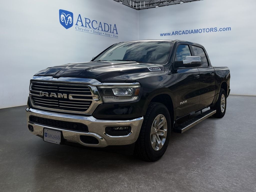 2023 RAM 1500 Laramie in Diamond Black Crystal Pearlcoat — front three-quarter view