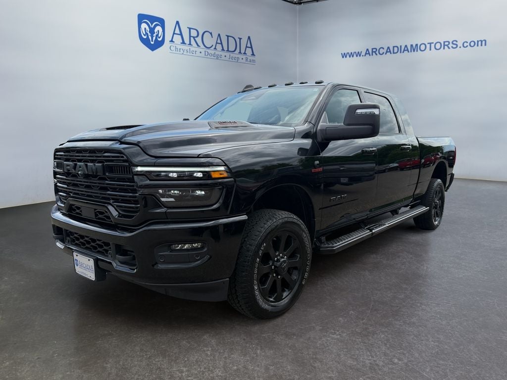 2025 RAM 2500 Laramie in Diamond Black Crystal Pearlcoat — front three-quarter view